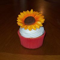 Sunflower Cupcake Vanilla cupcakes with buttercream frosting and gumpaste sunflowers painted with airbrush