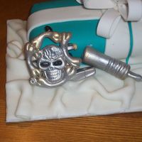 100_2035.jpg This is a gumpaste tattoo machine, painted with airbrush.