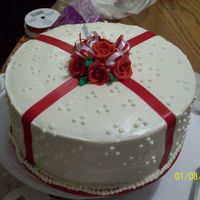 Red Velvet Cake royal icing roses w/ fondant ribbons on cake...real ribbon on roses. red velvet cake with cream cheese icing