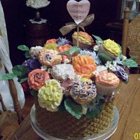 Cupcake Flower Basket basket weave on yellow cake with angel food cake cupcakes. I let my daughters pick the colors for the flowers and help decorate them for...