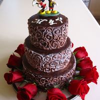 Chocolate Ganache Wedding Cake Three tier small wedding cake with yellow cake, dulce de leche filling, coated and piped in chocolate ganache. Topper is a Hallmark...