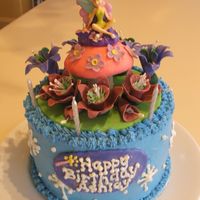 Tinkerbell Cake Chocolate with buttercream. All fondant decorations with Tinkerbell candle, Made for 6 year old Ashley's Tink themed party.