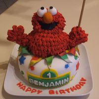 Elmo Cake White cake covered in fondant, Elmo is rice krispy treats covered in royal icing. Enjoy!