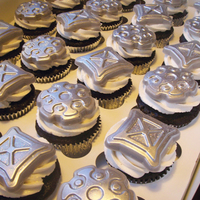 Steampunk Gear Cupcakes Dutch Chocolate cupcakes with vanilla buttercream, topped with molded white chocolate. White chocolate was dusted with silver then hit with...
