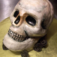 3-D Halloween Skull Cake This cake was created with the Wilton pan, red velvet, and covered in fondant. Once coated I hand painted the cake with gel paste food...