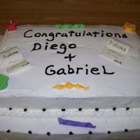 Graduation graduation cake covered with buttercream. The diplomas and caps were handmade with gum paste.