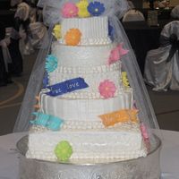 Lacey's Daisies French Vanilla with White Chocolate Strawberry Mousse filling and buttercream icing.All flowers and banners are MMF with a veil made from...