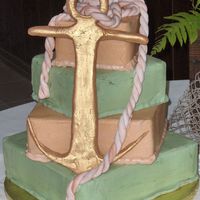 40Th Bd Golden Anchor Deep Dark Chocolate Cake with Buttercream Icing, Anchor and Rope made of MMF. Antique Gold Luster dust. Customer wanted the green to look...
