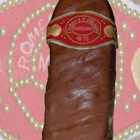 Romeo Y Julieta Cigar 9X13 Deep Dark Chocolate Cake covered with Mocha buttercream and then with MMF decorations and gold Dragees.