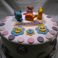 Baby Shower Cake. 4 layers of yellow cake, strawberry mousse in between layers, and then swiss butter cream in between the two cakes themselves. covered in...