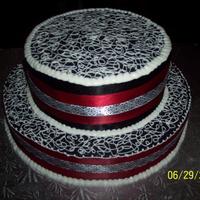 Black & White Round Cake Two Tiered, First attempt at using black in a cake. This is purely buttercream & satin ribbons.