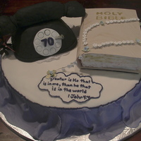 Phone & Bible Cake This is a buttercream cake, with fondant accessories. Phone is rice crispy treat covered in black fondant. Bible has hardened fondant...