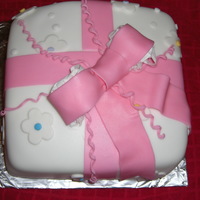 Mothers Day Bow Cake White fondant covering the entire cake with pink bow.
