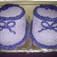 Purple Baby Booties I made these for my SIL's baby shower and they were a hit!This was my first try at cake sculpting, basketweave and bc roses (those...