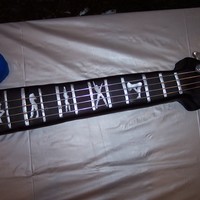 Bass Guitar Grooms Cake all cake.. everything edible except for strings, accents made out of chocolate, hand painted sexy girls