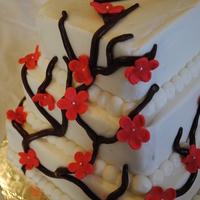 Cherry Blossom Buttercream-frosted with marshmallow fondant accents. 4", 6", 8" tiers