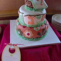 Clothesline Baby Shower Cake Fondant covered cakes w/ fondant accents, buttercream grass, chocolate-covered-chow-mein-noodle-molded laundry basket. Baby's name is...