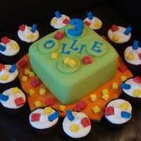 Lego 7" vanilla square cake with two layers of strawberry mousse filling and vanilla cupcakes with vanilla bean frosting!