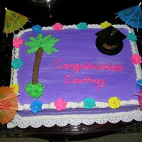 Luau Theme Graduation Cake This is a chocolate cake with fresh strawberries in the middle. The icing is buttercream and the flower's are made of royal icing.This...