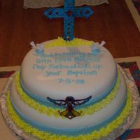 Baptism Cake Red Velvet cake with cream cheese frosting and covered with MMF. Details done with deco iceing.