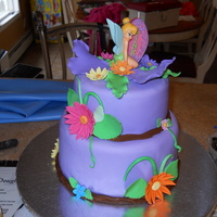 Tinker Bell I made this cake for my daughter's 9th birthday. It is vanilla cake with vanilla buttercream covered in fondant. Flowers are gumpaste...