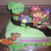 Dora Cake Fondant covered cake, Dora,Swiper and Boots were made from chocolate. Flowers, trees and bush made from fondant. and cookie crumb path....
