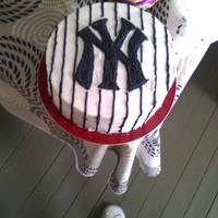 New York Yankee Pinstripe Cake The cake I made for my husband's birthday. Three layer chocolate cake with vanilla BC (Julie's Less Sweet Buttercream Frosting...