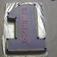1St Birthday Cake 11x15 sheet cake cut in the shape of a "1" . My friend wanted simple...white cake with buttercream and purple royal icing drop...