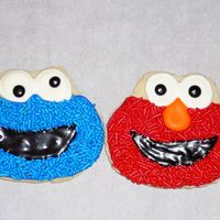 Elmo And Cookie Monster Cookie Elmo amd cookie for my sons 1st birthday party. the other ones in my photo were the test cookies. i think these came out much better. nfsc...