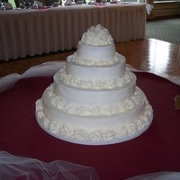 Courtney's Wedding Cake All buttercream - 200+ buttercream roses!! This was a cake for my cousin's wedding. I don't remember the flavors anymore - sorry...