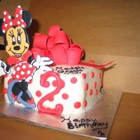Minnie Mouse Minnie is made using color flow. The Bow is Fondant and Gum paste. This is a 8x8 in square . I used Butter Cream icing and BC polka Dots....