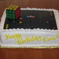 80's Theme Birthday Cake 80's theme birthday cake for a 30th birthday party. Rubik's cube is made of rice crispy treats, covered in black fondant with...