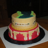 Foreign Fantasies This cake was made for a client who loves foreign countries. Top tier is Egyptian and has rice paper heiroglyphs. The bottom tier is Indian...