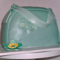 First Purse Cake Teal/green purse with brush embroidery and button flower