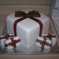 Christmas Presants red velvet cake with cream cheese frosting. white fondant. ribbon. TFL