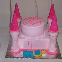 Princess Castle Made with buttercream and ice cream cones. Sleeping Beauty is made of 50/50 gum paste and fondant.