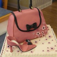 Pretty In Pink The cake is pound cake with cream cheese frosting and the purse is also pound cake covered with fondant. The shoe is make from gum paste.