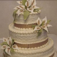 Forever This cake is Italian Cream with Cream Cheese icing. The gold band and the lilies are made from fondant.