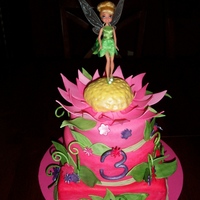 Tinkerbell I was aked to make a Tinkerbell cake. The Tinkerbell figure is plastic, everthing else is edible