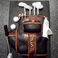 Golf Bag I had a lot of fun with this cake. I used homemade white chocolate candy fondant and painted it the colors of the actual bag.