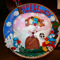 Have A Smurf Valentines Day!!! everything is edible except the white fence characters are made out of gumpasteenjoy!!! have a nice day!!