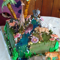 My Daughters Jungle Bday Cake this for my daughters 7th bday she wanted jungle animals on her cake the cake is scratch chocolate with bavarian creme and iced with...