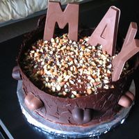 Chocolate Heaven chocolate cake, chocolate frosting, chocolate wrap, chocolate forms and almonds. Best thing you can ever put in your mouth.