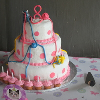 Cat Birthday Cake BC with fondant cats. I didn't have room for the 8 candles on the cake so I make cupcakes and used them for the candles