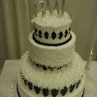 Daisies And Diamonds This cake is full of gum paste daisies and fondant diamonds.