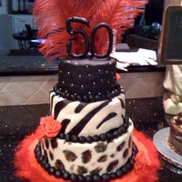 50Th Birthday Cake My first 3 tiered cake...very nerve wracking.I used the Ace of Cakes fondant and had the hardest time painting on it!! Anyone else with...