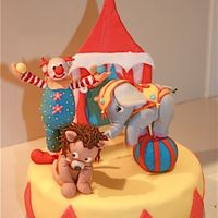 Circus Cake A chocolate fudge cake with chocolate ganache as icing and covered with sugarpaste.