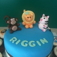 Animal Shower Cake 6" cake with fondant animals surrounded by cupcakes
