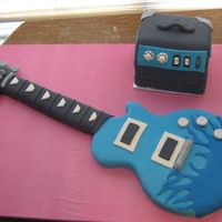 Guitar Guitar and amp are both all carved cake iced in BC and covered with fondant.