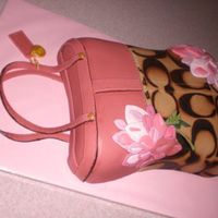 Coach & Pink Flowers Based off of a real Coach handbag. 2-9x13s torted, stacked, filled & carved, covered in fondant. All edible. The birthday girl loved it...